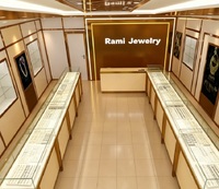 Vitrine de présentation de bijoux de luxe en or rose avec éclairage LED, vitrine en verre haut de gamme pour les bijouteries haut de gamme