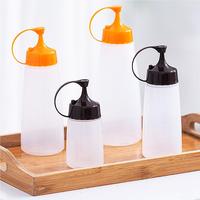 Bouteille de sauce à buse ronde de haute capacité de qualité alimentaire Bouteille à presser en plastique réutilisable Distributeur de sauce lavable pour le service alimentaire