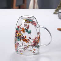 Vente en gros de tasses à café en verre à double paroi résistantes à la chaleur en borosilicate de haute qualité avec poignée pour fleurs séchées