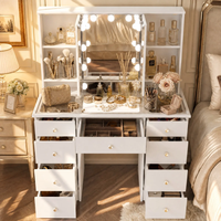 Vente en gros de bureau de maquillage en MDF blanc avec miroir triple éclairé, plateau en verre et 9 tiroirs
