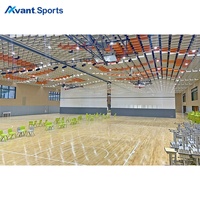 Solution Avant Sports Hall pour gymnase scolaire et salle polyvalente avec revêtement de sol, panneaux de séparation, rideaux et sièges rétractables