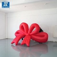 Modèle gonflable géant personnalisé en forme de nœud rouge suspendu pour les festivals, les fêtes, les vitrines de magasins, la publicité en extérieur, décoration gonflable