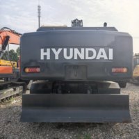 Excavatrice sur pneus Hyundai 210 d'occasion avec stabilisateurs télescopiques antidérapants, économie de carburant intelligente, contrôle électronique