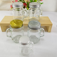 Jarra de Vidrio Pequeña de 120 ml (4 oz) con Asa y Tapa Metálica Plateada, para Sal, Pimienta, Café, Vodka o como Vaso para Shots