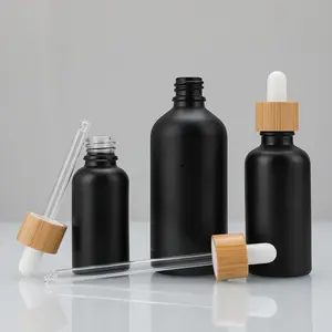 5ml 10ml 20ml 30ml 50ml 100mL Botella de suero negro mate esmerilado Tapa de bambú Aceite esencial para el cabello Botellas cuentagotas de vidrio