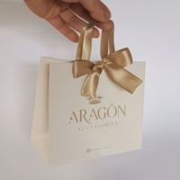 Nouveauté 2026 : Sacs d'emballage cadeau haut de gamme personnalisés avec logo estampé et poignées en ruban rose pour bijoux