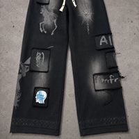 Pantalon large à cordon de serrage Kornit DTG, motif graphique vintage à lettrage ondulé et éclaboussures d'éclairs, entièrement imprimé, avec trous effilochés, coupe ample