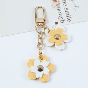 Porte-clés de luxe en cuir PU tendance, forme fleur, imprimé en relief, élégant, cadeau original pour femme - Product Image 4