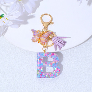 Porte-clés en acrylique violet en forme de papillon à franges, avec lettre initiale en forme de flocon de neige, en gros - Product Image 6