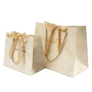 Produttori di lusso boutique regalo sacchetto di imballaggio carta personalizzata grazie sacchetti regalo con nastro logo stampato
