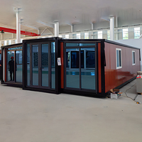 Maison en conteneur extensible professionnelle la moins chère Maison de bureau en acier de 20 pieds Maison en conteneur préfabriquée modulaire
