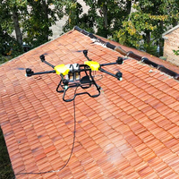 Drone de nettoyage haute pression UAV à jet d'eau de précision pour l'entretien professionnel des fenêtres de grandes tours et l'entretien extérieur des usines