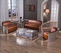 Canapé et fauteuil Spitfire Industrial Vintage en cuir et autres meubles anciens