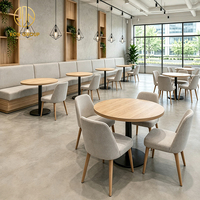 Ensemble de restaurant Ron Group : Table ronde en bois, chaise en tissu avec structure en bois, banquette rembourrée, mobilier commercial pour café