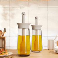 Bouteille d'huile en verre intégrée avec pinceau applicateur en forme de patte, distributeur d'huile anti-fuite en silicone monobloc pour barbecue, cuisson et pâtisserie