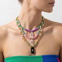 Collier pendentif bohème coloré fait main en pierres naturelles (agate noire, turquoise bleue, apatite, améthyste) pour femme