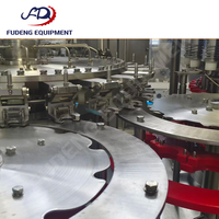 Machine de remplissage 99 % neuve à 24 têtes, contrôlée par PLC, haute performance, 12 000 bph pour bouteilles en plastique, eau pure et boissons