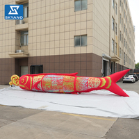 Modèle d'art gonflable personnalisé en forme de poisson rouge découpé en papier pour la publicité extérieure des marchés scéniques du Festival du Printemps