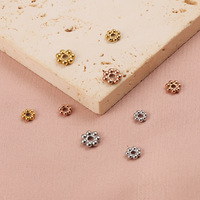 Vente en gros d'accessoires de bijoux en acier inoxydable Composants d'espacement de perles de type flocon de neige Bijoux de bricolage pour la fabrication de bracelets et de colliers