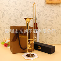 Miniature de trombone en cuivre doré, modèle d'ornement décoratif pour la maison, instrument de musique artisanal, emballage en boîte carrée noire, broche trombone