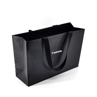 Sac d'emballage cosmétique noir mat personnalisé avec logo imprimé, sac en papier pour vêtements, sac cadeau d'affaires avec nœud en ruban