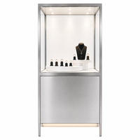 Vitrines à bijoux minimalistes de luxe, disponibles en couleurs personnalisées, idéales pour les centres commerciaux haut de gamme et les bijouteries.