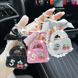 Porte-clés Sac Diamant Complet Créatif avec Chaîne de Perles et Nœud, Pendentif Diamant Brillant Personnalisé Exquis pour Voiture - Product Image 1