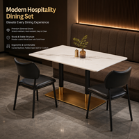 Ensemble de table à manger rectangulaire en pierre frittée moderne avec base dorée et chaises rembourrées noires, mobilier commercial pour hôtel et restaurant