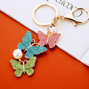 Llavero de mariposa de cristal brillante y colorido, colgante de metal con forma de insecto y detalles de perlas, adorno para bolso, joyería para mujer - Product Image 2