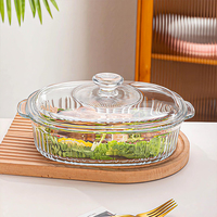 Plats de service modernes ovales en verre transparent avec couvercles pour la cuisson, le maintien au chaud et la présentation des aliments, idéaux pour les fêtes à domicile et la cuisine.