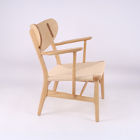 Mobilier de loisirs moderne nordique accoudoir chaise en bois cadre en bois massif siège en rotin pour salon chaise longue