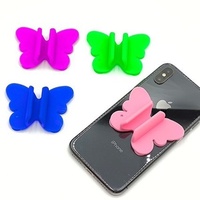 Support de téléphone multifonction en silicone à ventouse style papillon, support de rouge à lèvres anti-choc pour utilisation au lit, pour rouge à lèvres et brillant à lèvres