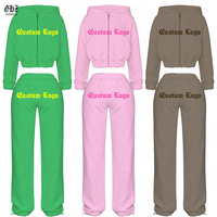 Ensemble de survêtement 2 pièces pour femme : sweat à capuche court zippé à épaules tombantes et manches longues bouffantes, et pantalon large à taille élastique avec cordon de serrage