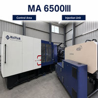 Machine de moulage par injection d'occasion de 650 tonnes pour la fabrication de grandes chaises en plastique, caisses, pare-chocs et seaux – Haute performance
