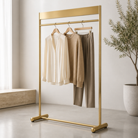 Porte-vêtements en métal doré, sur pied, pour boutique de vêtements, fabrication sur mesure pour magasins de détail