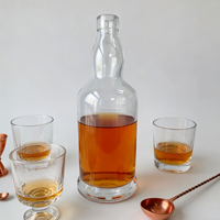 Bouteille en verre rond en flint de 700 ml et 750 ml, durable, disponible en stock, pour spiritueux distillés, whisky, tequila, vodka avec bouchon en liège