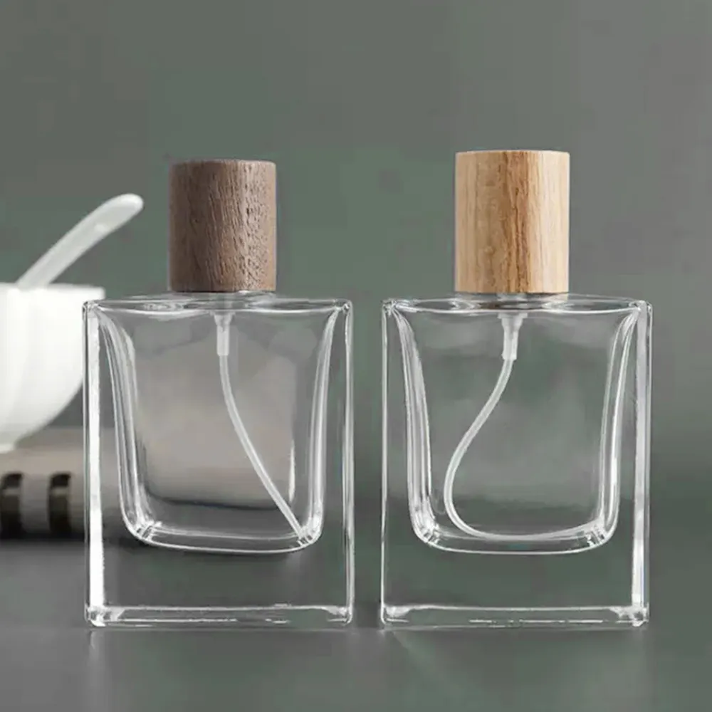 25ml 30ml 50ml Square Shape luxurious transparent glass perfume bottle with wooden cap aromatherapy bottle with gold sprayer