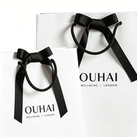 Sac cadeau en papier blanc personnalisé avec poignée en corde de papier noir, nœud en satin, sacs fourre-tout de luxe pour boutique, emballage haut de gamme pour vêtements