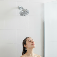 Pommeau de douche pluie rond moderne en chrome 10 cm à texture haute et trous de formes variées, installation facile pour salle de bain d'appartement