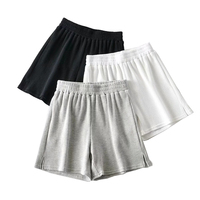 Shorts amples en tissu gaufré uni à taille haute pour femmes, avec fente latérale, par un fournisseur de vêtements de rue