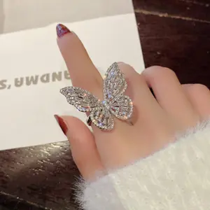 韓国のトレンディなウェディングジュエリー誇張された中空の調節可能なリング女性のための光沢のある蝶のオープニングリング