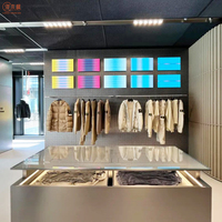 Nouvelle boutique Vitrine de vêtements Design personnalisé Table vitrine en acier inoxydable pour magasin de vêtements