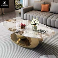 Table basse ovale de luxe en marbre de style européen et américain, avec support créatif en métal en forme de boule, pour salon moderne