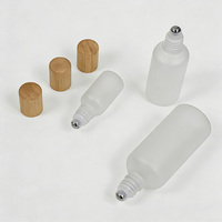Bouteilles compressibles en verre dépoli personnalisées en gros avec bouchon en bambou, pots vides anti-fuite pour huile capillaire, sérum pour le cuir chevelu et produits de soin de la peau