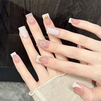 Faux ongles en acrylique Gentle Fairy à presser, dégradé rose nude, violet clair, pointe française ondulée, étoile dorée en relief, fleur embossée