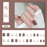 Vente en gros de faux ongles en acrylique R664 de haute qualité 24 pièces pointes de gel de presse réutilisables conception de papillon d'amande fournitures de manucure d'art d'ongle