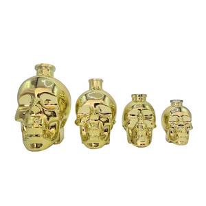 Bouteille à liqueur en verre fantaisie vide de 750 ml en forme de visage avec bouchon doré électrolytique personnalisé pour whisky, <span class=keywords><strong>tequila</strong></span>, vodka – Vente en gros - Product Image 1