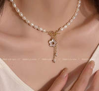 Biji nasi air segar mutiara kecil bunga aster kalung feminim jaring merah segar cangkang air collarbone desain rasa