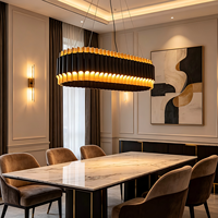 Lustre ovale moderne de luxe sur mesure, suspension LED noire et or à effet vague, garantie 2 ans, pour salle à manger et éclairage de projets hôteliers