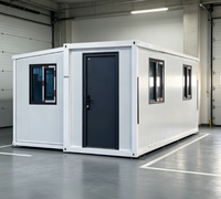 Bureau modulaire blanc en conteneur, maison préfabriquée portable avec fenêtres à cadre noir et structure en acier robuste, installation rapide